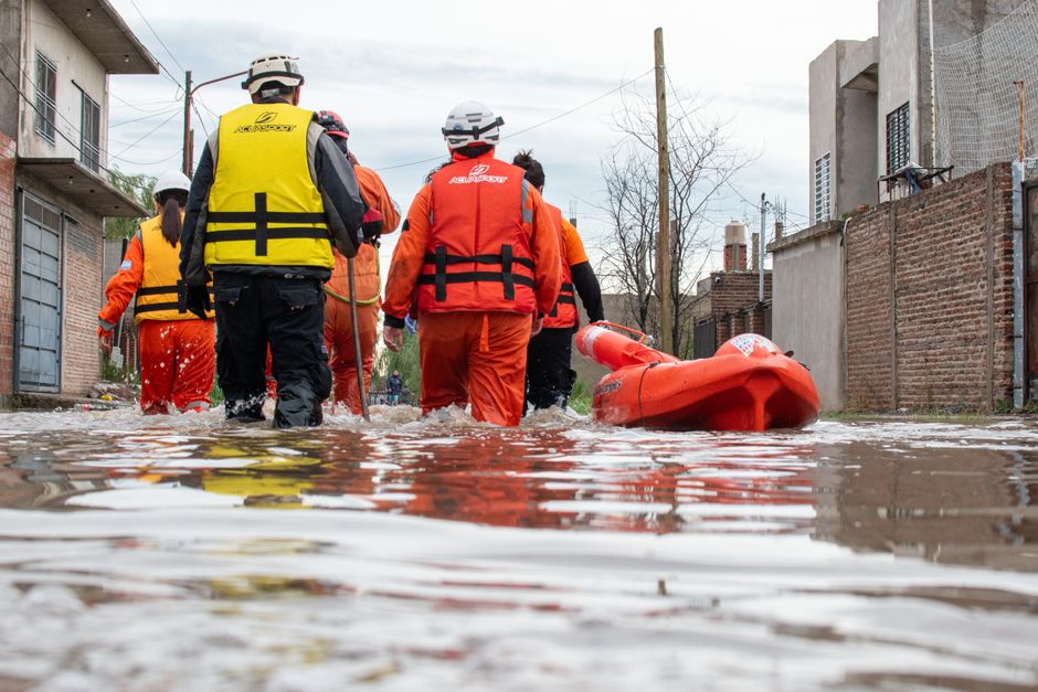 Rescue team in action during flooding in Buenos Aires, aiding relief efforts in affected neighborhoods.