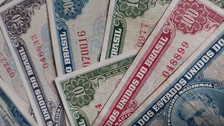 Close-up of vintage Brazilian banknotes, featuring intricate designs and historical value.